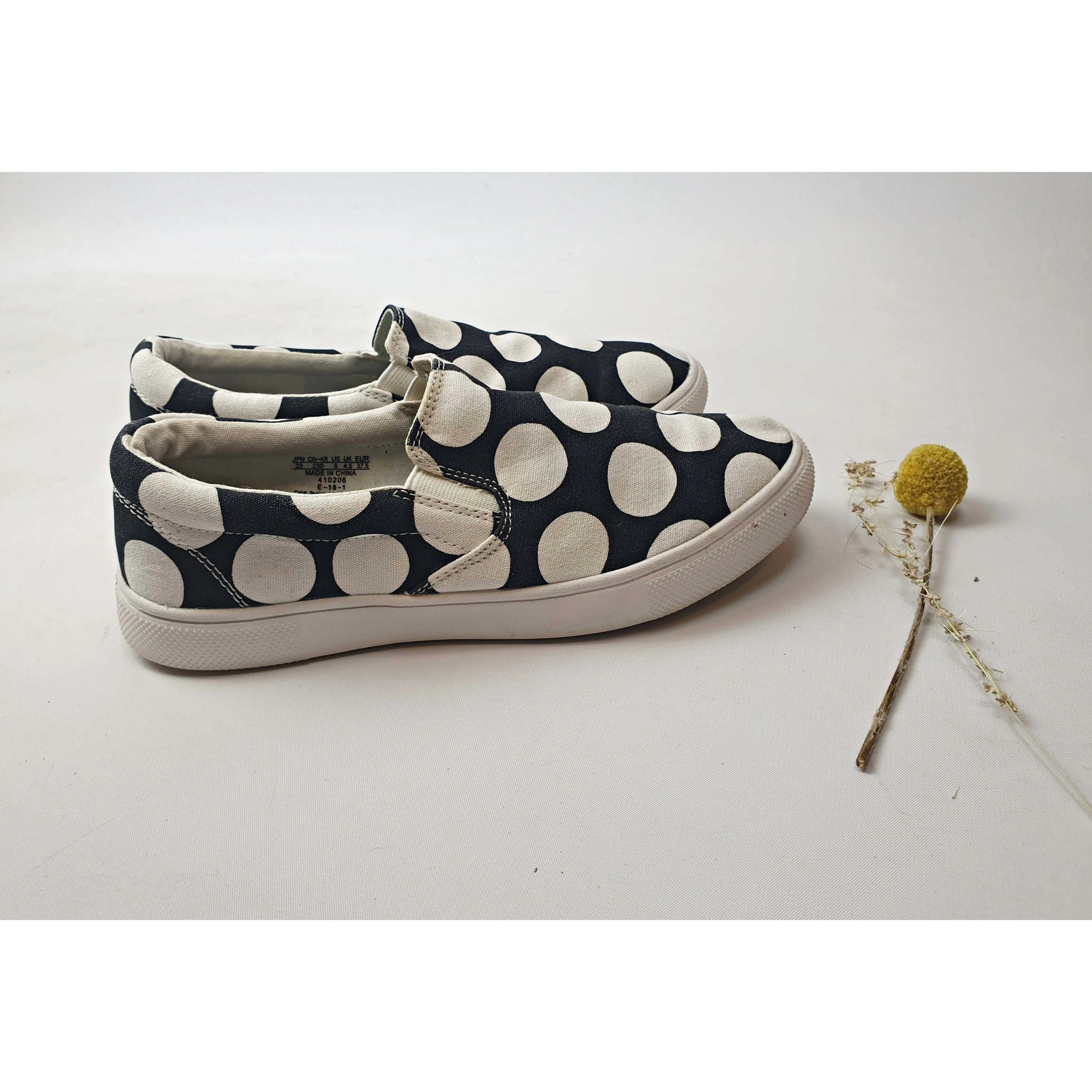 Marimekko x Uniqlo light weight black slide on shoes with large white polka dots size 6